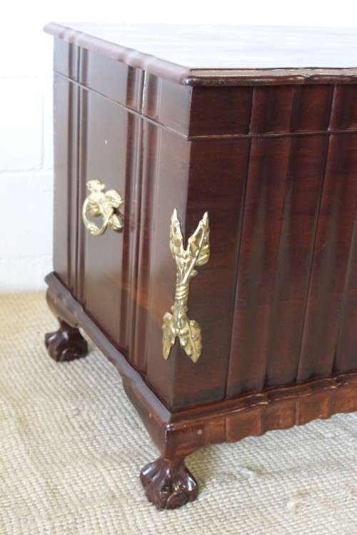 A magnificent large and HEAVY hand carved solid Imbuia ball & claw Kist with brass embellishments