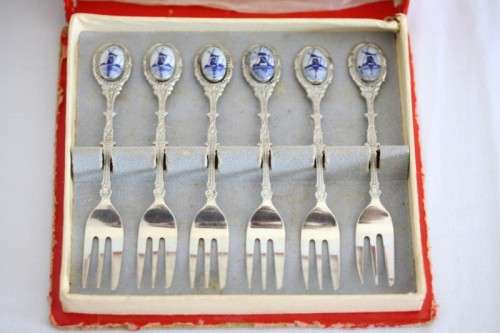 An awesome boxed set of six Dutch made silver plated cake forks with blue and white decals