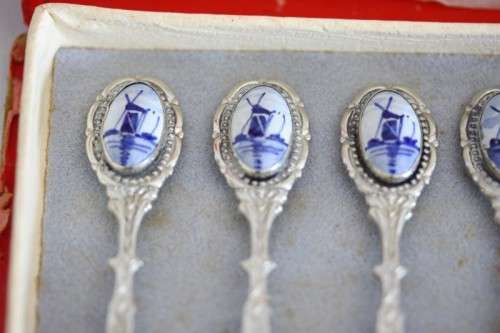 An awesome boxed set of six Dutch made silver plated cake forks with blue and white decals