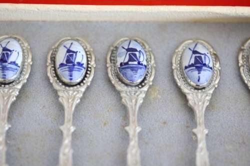 An awesome boxed set of six Dutch made silver plated cake forks with blue and white decals