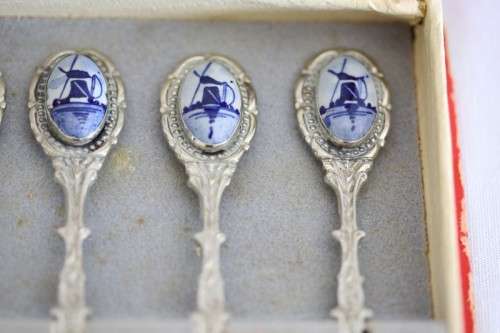 An awesome boxed set of six Dutch made silver plated cake forks with blue and white decals