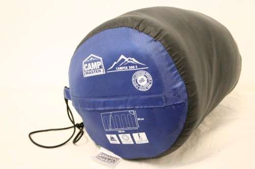 An awesome "Camp master 200E" hollow fibre, temperature rating sleeping bag in its carry bag.