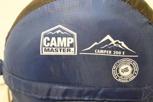 An awesome "Camp master 200E" hollow fibre, temperature rating sleeping bag in its carry bag.