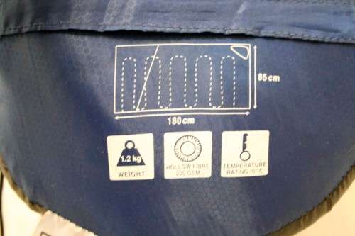 An awesome "Camp master 200E" hollow fibre, temperature rating sleeping bag in its carry bag.