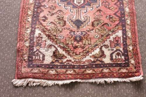 An awesome vintage/ antique? hand dyed Persian carpet (127cm x 80cm) with red and earthy tones