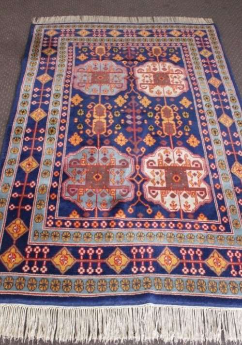 A beautiful and very well made colourful Russian Derbent carpet in light & dark blue, reds and rust