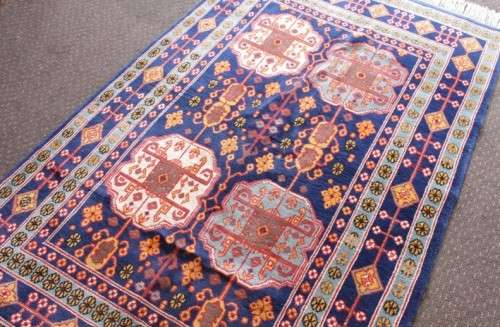 A beautiful and very well made colourful Russian Derbent carpet in light & dark blue, reds and rust