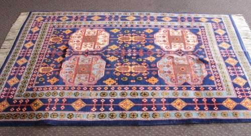 A beautiful and very well made colourful Russian Derbent carpet in light & dark blue, reds and rust