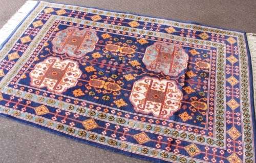 A beautiful and very well made colourful Russian Derbent carpet in light & dark blue, reds and rust