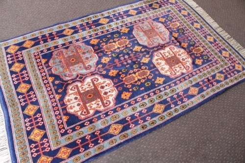 A beautiful and very well made colourful Russian Derbent carpet in light & dark blue, reds and rust