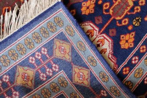 A beautiful and very well made colourful Russian Derbent carpet in light & dark blue, reds and rust