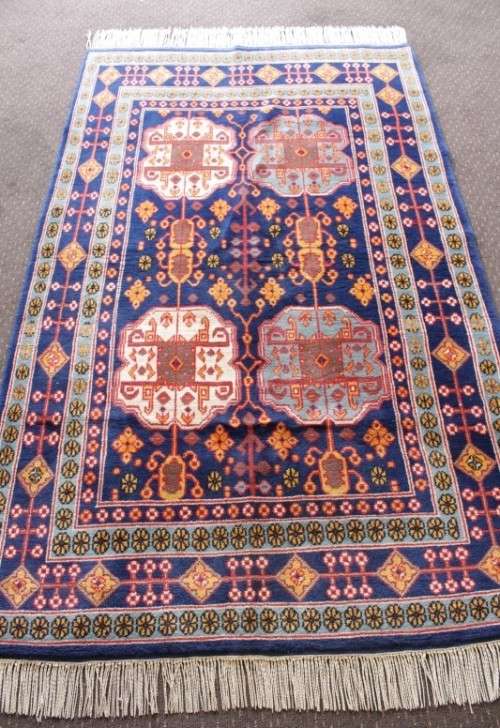 A beautiful and very well made colourful Russian Derbent carpet in light & dark blue, reds and rust