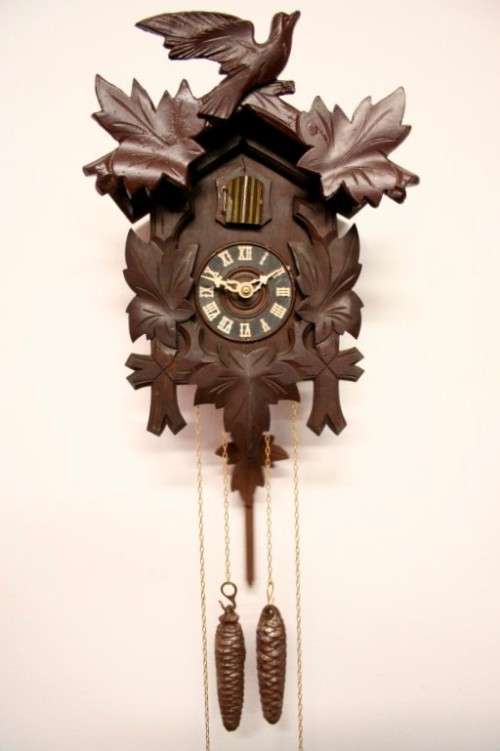 A fabulous rare original vintage hand carved German made 8-day Black Forest cuckoo clock.