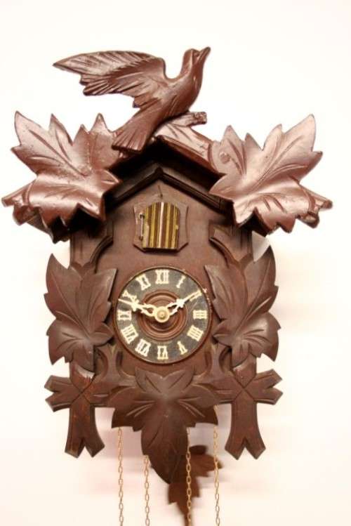 A fabulous rare original vintage hand carved German made 8-day Black Forest cuckoo clock.