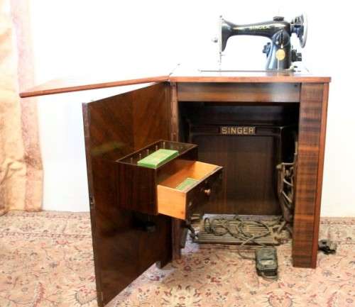 **RS17** An antique (1935) Singer electric sewing machine in its original cabinet w/ accessories