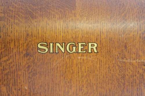 A stunning antique 1937 Singer 99K hand-cranked sewing machine w/ loads of accessories & attachments