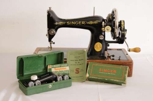 A stunning antique 1937 Singer 99K hand-cranked sewing machine w/ loads of accessories & attachments