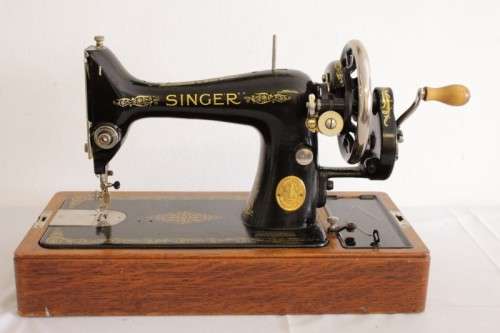 A stunning antique 1937 Singer 99K hand-cranked sewing machine w/ loads of accessories & attachments