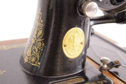A stunning antique 1937 Singer 99K hand-cranked sewing machine w/ loads of accessories & attachments