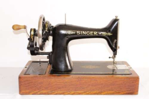 A stunning antique 1937 Singer 99K hand-cranked sewing machine w/ loads of accessories & attachments