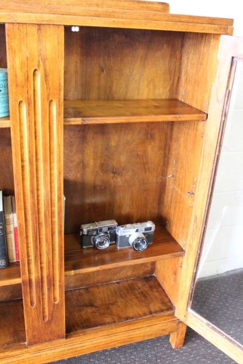 A wonderful Art Deco vintage oak display/ show cabinet with glass doors and carved detailing!