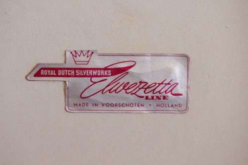 **RS17** A boxed set of Royal Dutch Silverworks "Elwezetta Line" chrome plated spoons & tea strainer