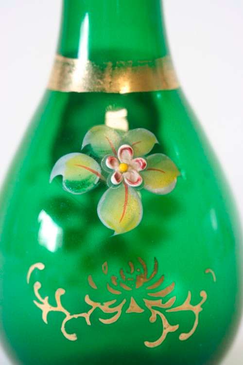 A superb vintage green Venetian glass, hand painted raised floral and gold gild detail vase.