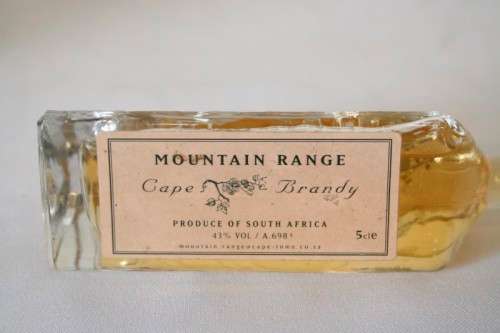4 miniature Mountain Range sealed bottles of Cape brandy and Cream sherry, for display purposes only