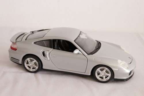 A stunning silver 1/18 scale (1999) Porsche 996 Turbo die-cast model car by Bburago