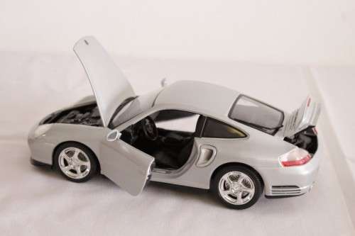 A stunning silver 1/18 scale (1999) Porsche 996 Turbo die-cast model car by Bburago