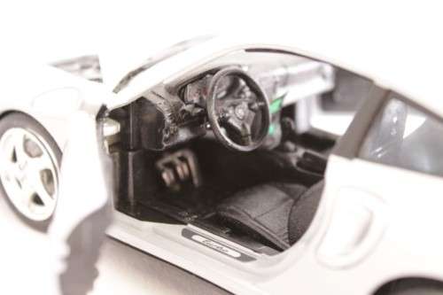 A stunning silver 1/18 scale (1999) Porsche 996 Turbo die-cast model car by Bburago