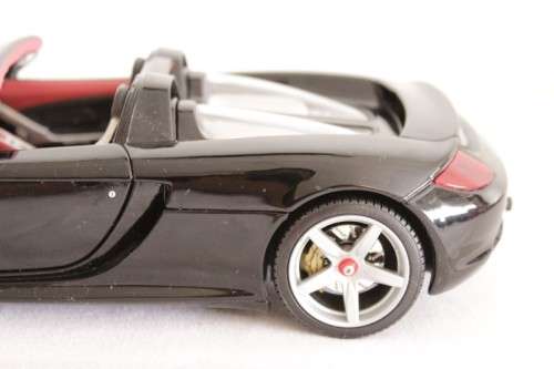 A fantastic black 1/18 scale (2005) Porsche Carrera GT die-cast model car by Motormax