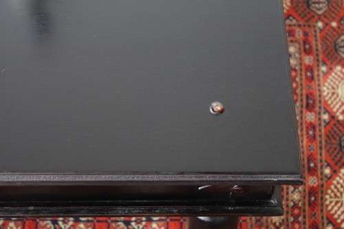 A stunning Indonesian Teak coffee table with clean lines, thick turned legs and carved detailing