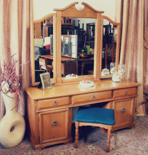 An exquisite, large Oak three drawer side-folding mirror dressing table with two cupboards and stool