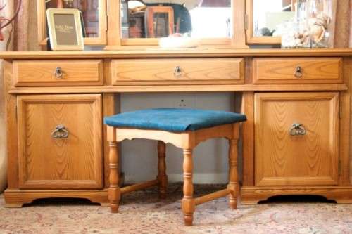 An exquisite, large Oak three drawer side-folding mirror dressing table with two cupboards and stool