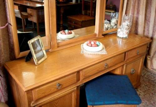 An exquisite, large Oak three drawer side-folding mirror dressing table with two cupboards and stool