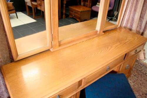 An exquisite, large Oak three drawer side-folding mirror dressing table with two cupboards and stool