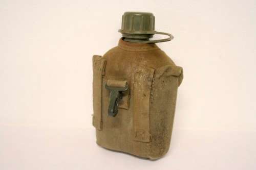 **RS17** A vintage olive green SADF military water bottle with webbing cover in good condition