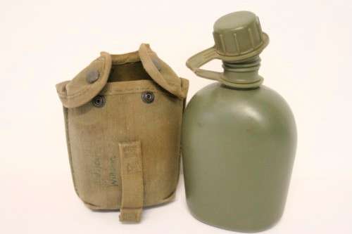 **RS17** A vintage olive green SADF military water bottle with webbing cover in good condition