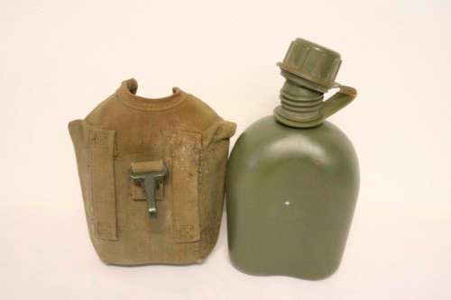 **RS17** A vintage olive green SADF military water bottle with webbing cover in good condition