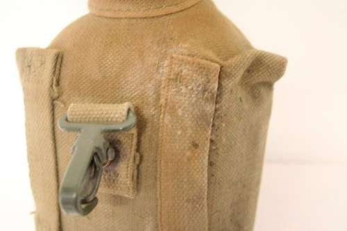 **RS17** A vintage olive green SADF military water bottle with webbing cover in good condition