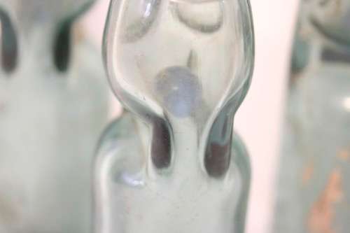 Four amazing antique (late 1800's) glass codd-neck bottles with their marbles in the bottles.
