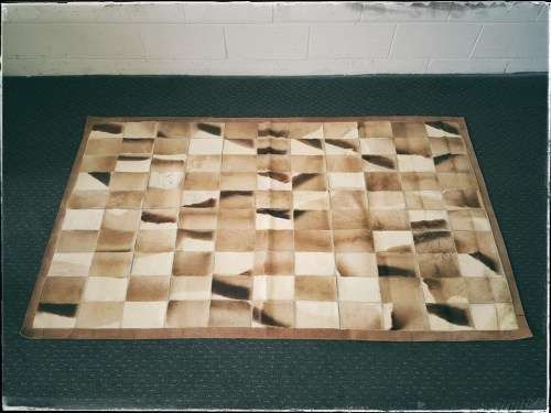 **RS17** A stunning rectangular (1,8m x 1,07m) Springbok hide rug/ mat with hand stitched detailing