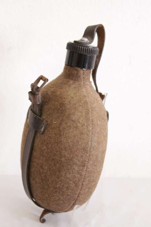 An awesome vintage WWII German/ Czechoslovakian aluminium water canteen with a felt covering