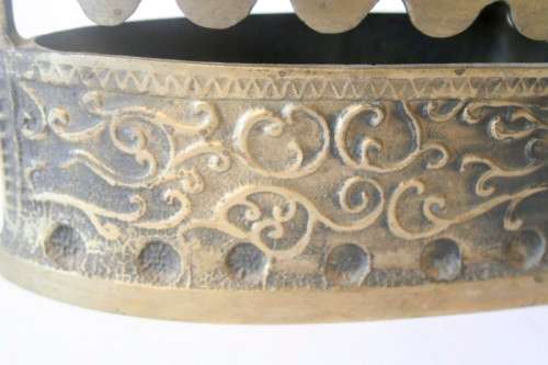 A fabulous very ornate antique brass sad iron/coal iron. Stunning as a display piece.