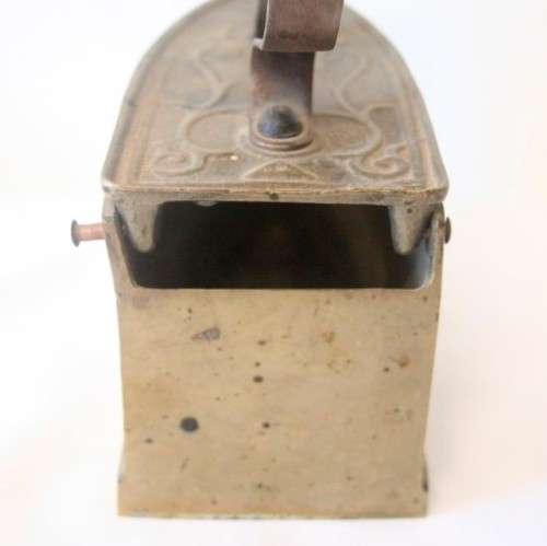 A fabulous very ornate antique brass sad iron/coal iron. Stunning as a display piece.