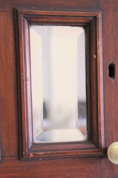 A stunning antique solid oak bathroom corner vanity cabinet w/ bevelled mirrors and carved detailing