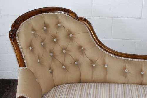 An incredible antique Victorian solid hand carved Mahogany upholstered Chaise Lounge on castors