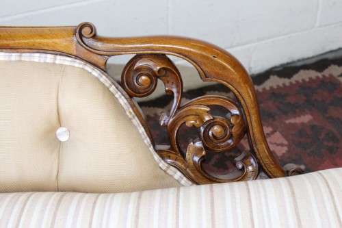 An incredible antique Victorian solid hand carved Mahogany upholstered Chaise Lounge on castors