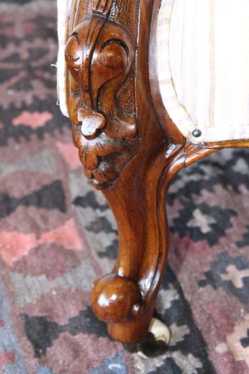 An incredible antique Victorian solid hand carved Mahogany upholstered Chaise Lounge on castors